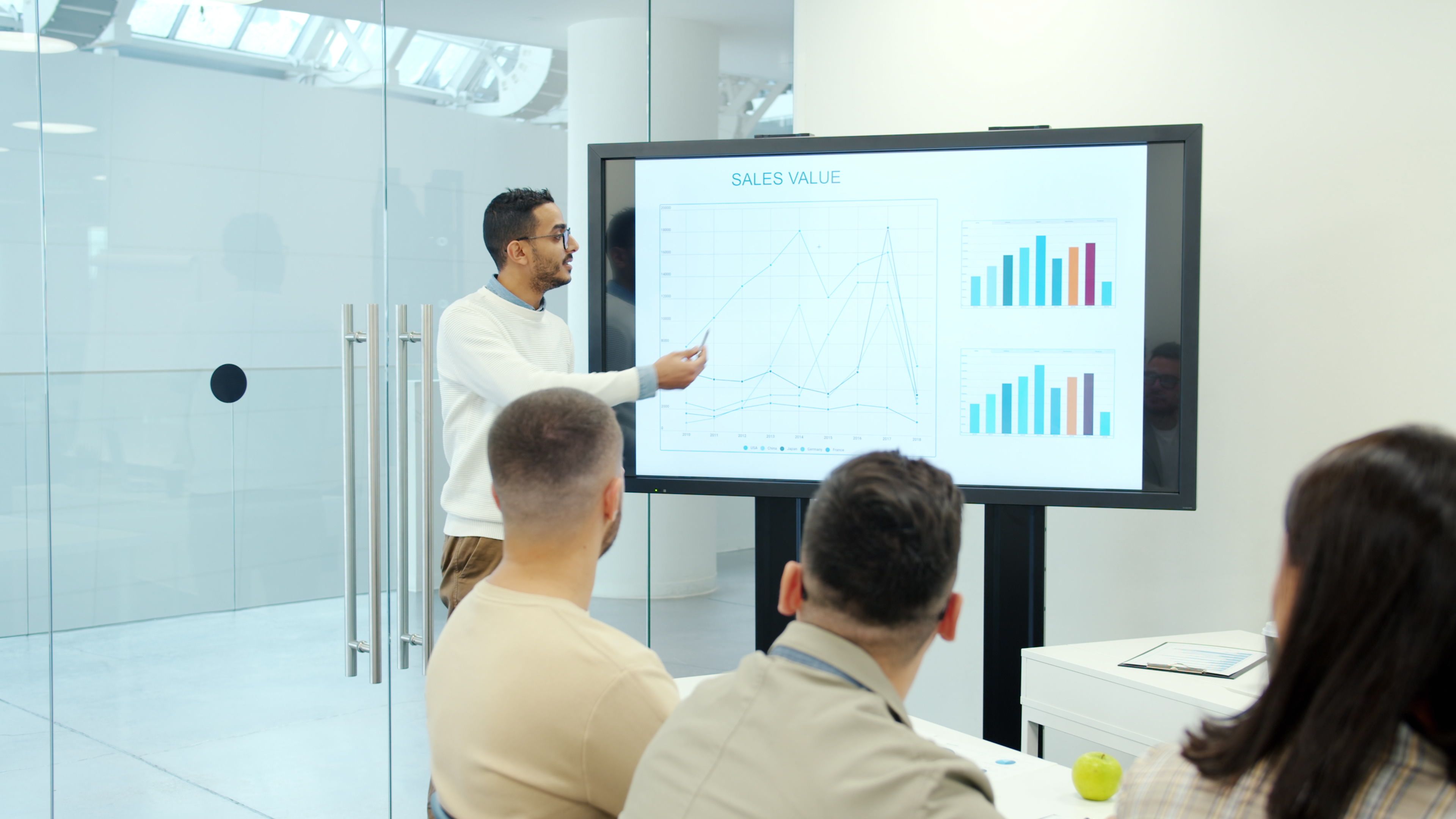 Professional business presentation focused on sales growth charts and financial performance
