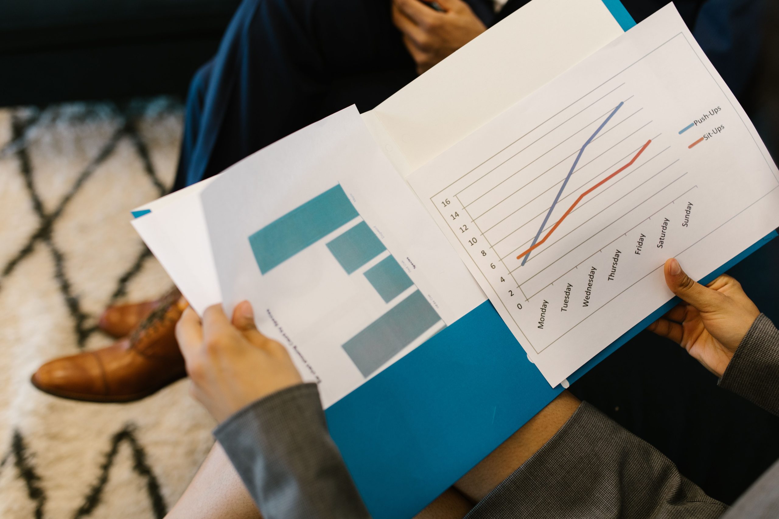 Business reports with graphs being reviewed during a corporate meeting